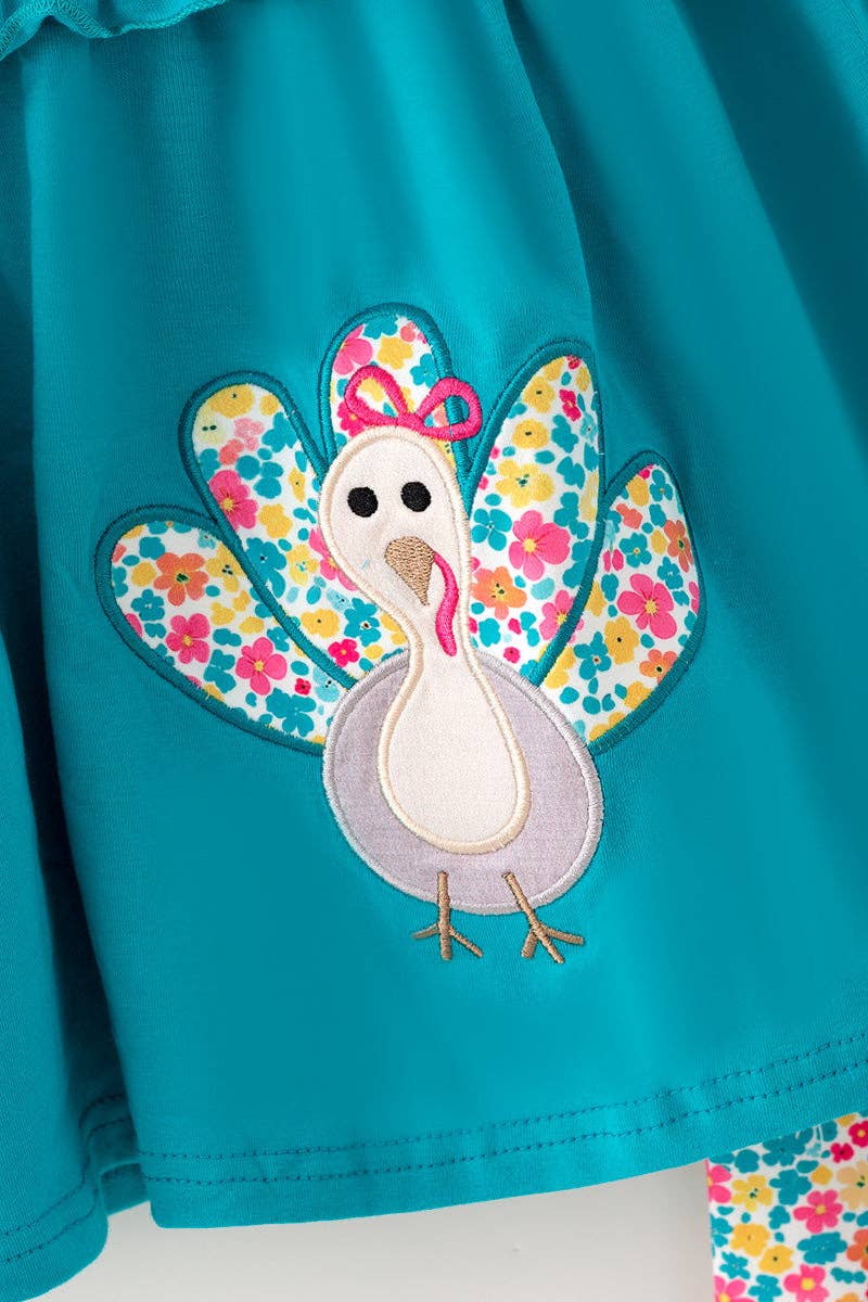 Teal tunic w/ turkey applique and floral bell bottoms